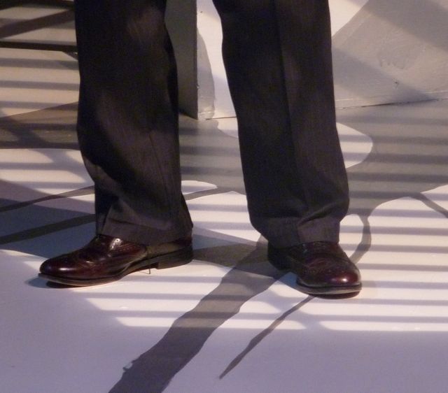 An actor's feet on stage