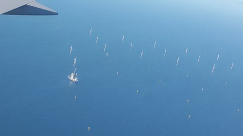 Windfarm and drilling platform in North Sea