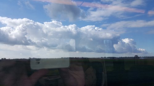A train of clouds viewed from the train